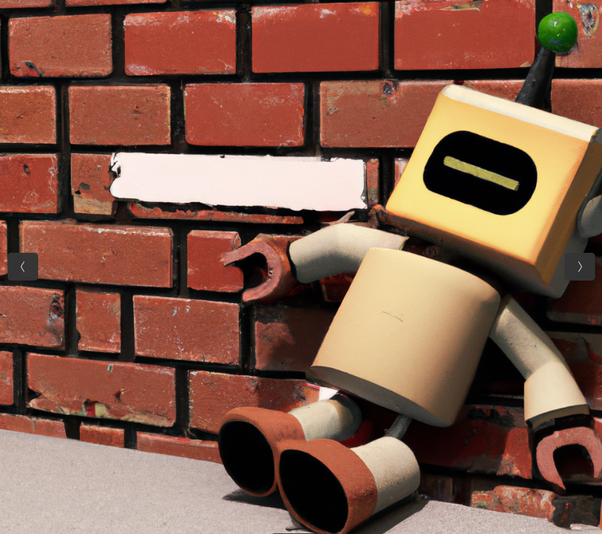 small cute robot unable to move past a brick wall